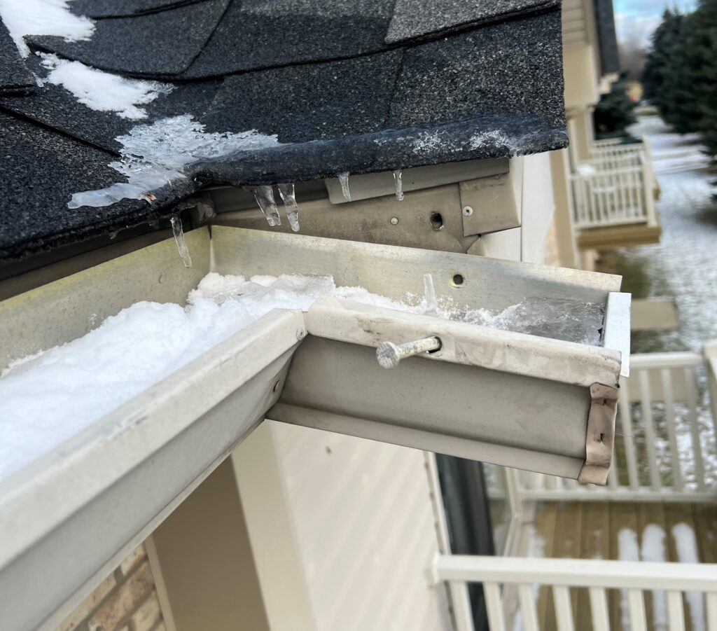 Gutter Ice Dam and causing gutter to fall off of house.