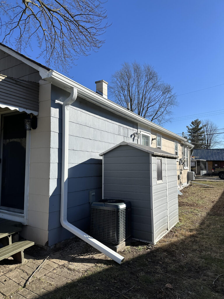 White custom 5 and 6 inch seamless gutter installation in Macomb Michigan 48044.