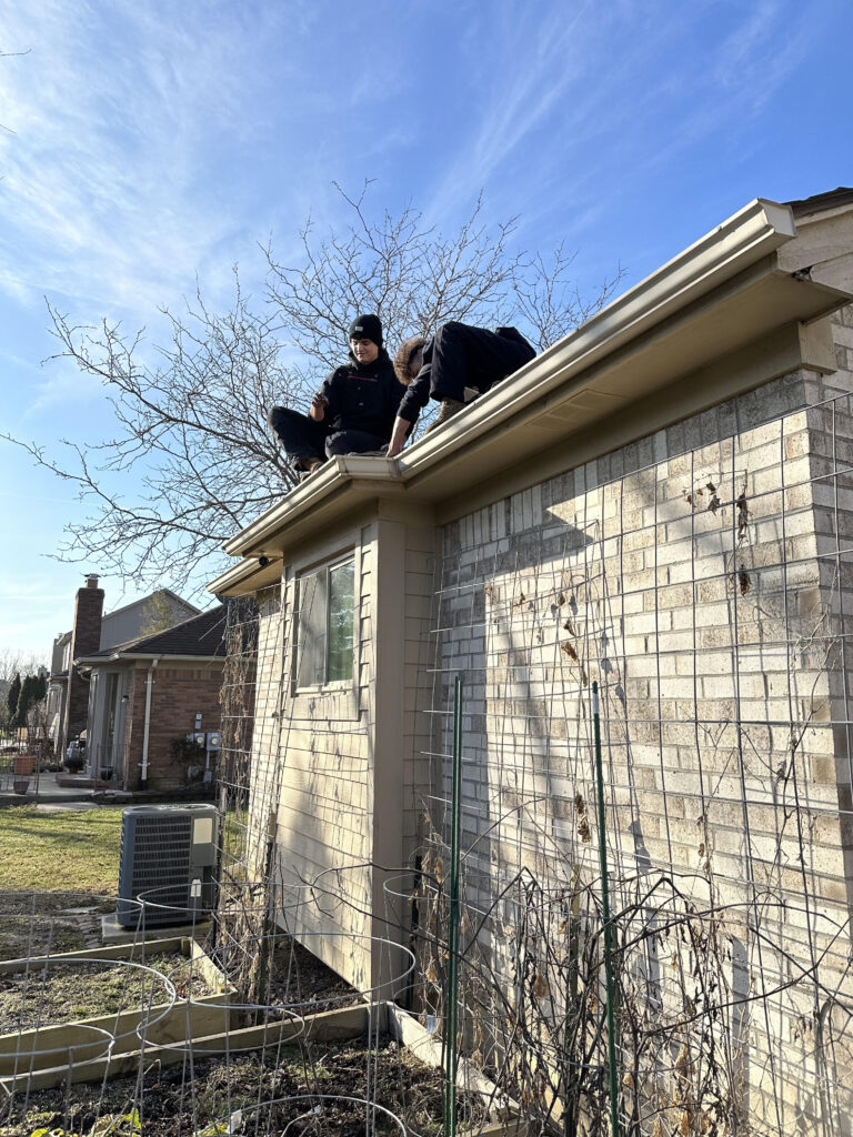 Gutter Cleaning Shelby Township with 2 of our technicians at J&A Exterior Seamless Gutters.