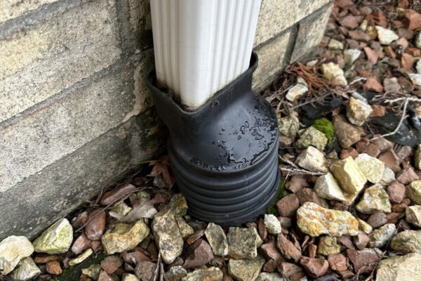 Drain pipe into rocks from downspout