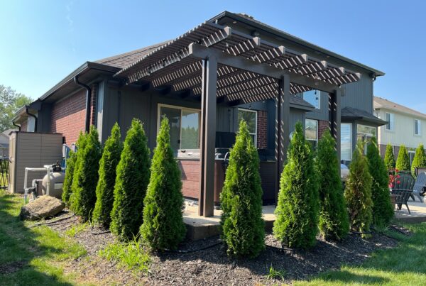red brick home with black gazebo
