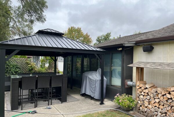 brown and beige home with black gazebo