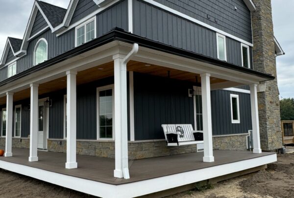 New build grey and white house with black gutters