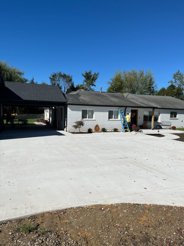 home with white siding and black gutters
