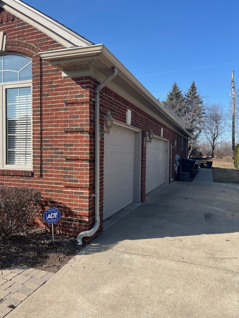 red brick home with clay gutters