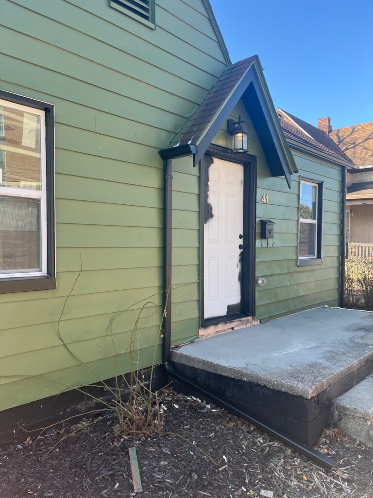 green house with white door