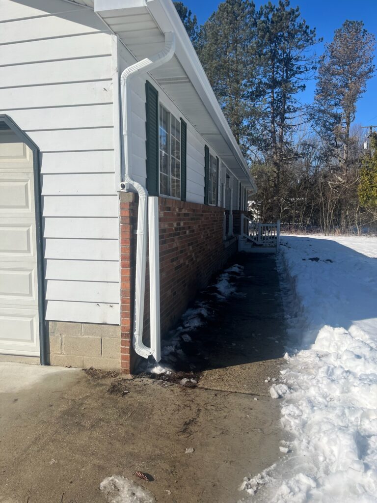 red brick home with white siding