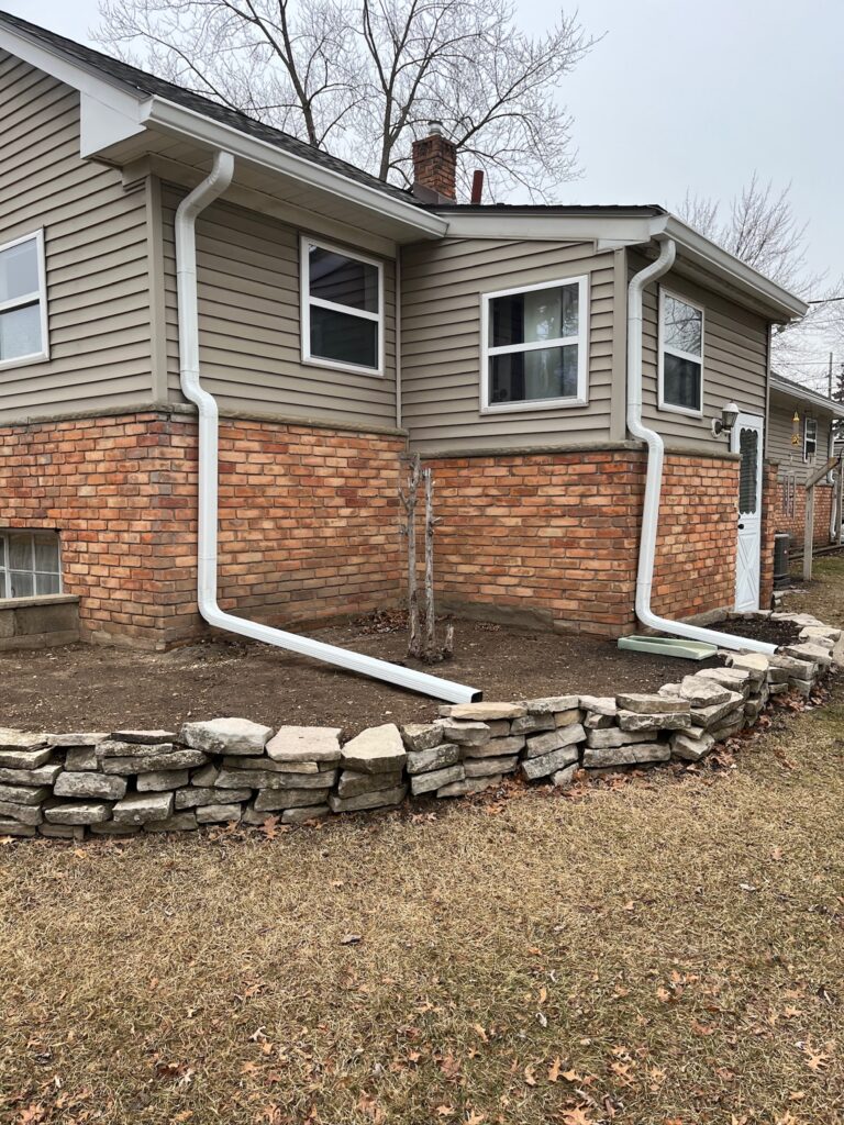 red brick and beige sided two story home