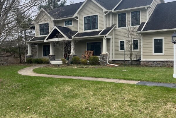 large white brick two story home