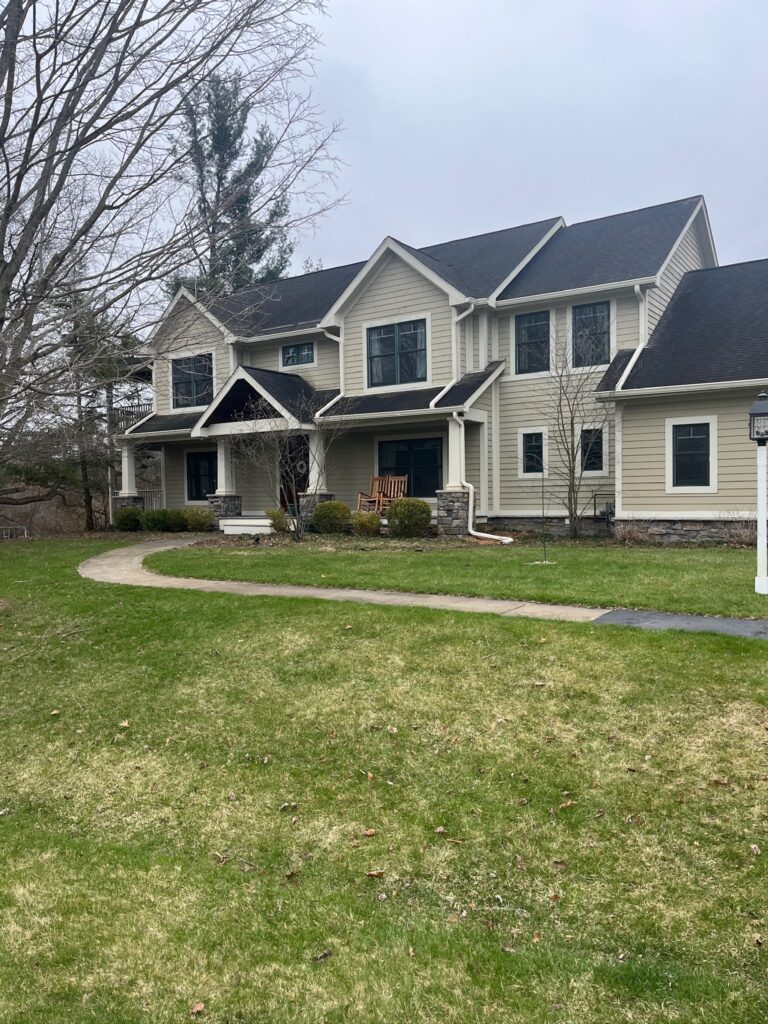 large white brick two story home