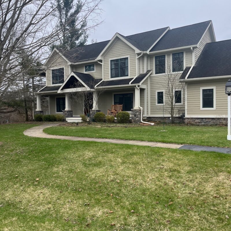 large white brick two story home
