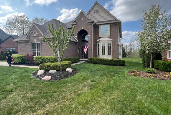 large 2 story brown brick home
