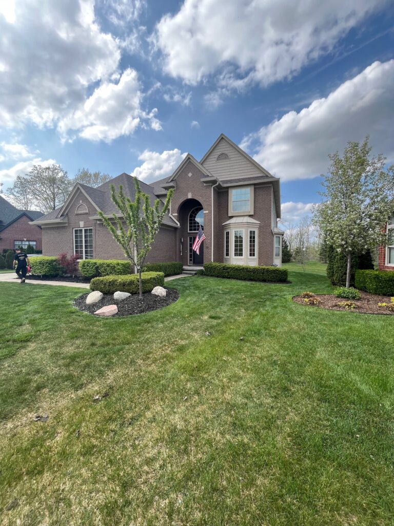 large 2 story brown brick home