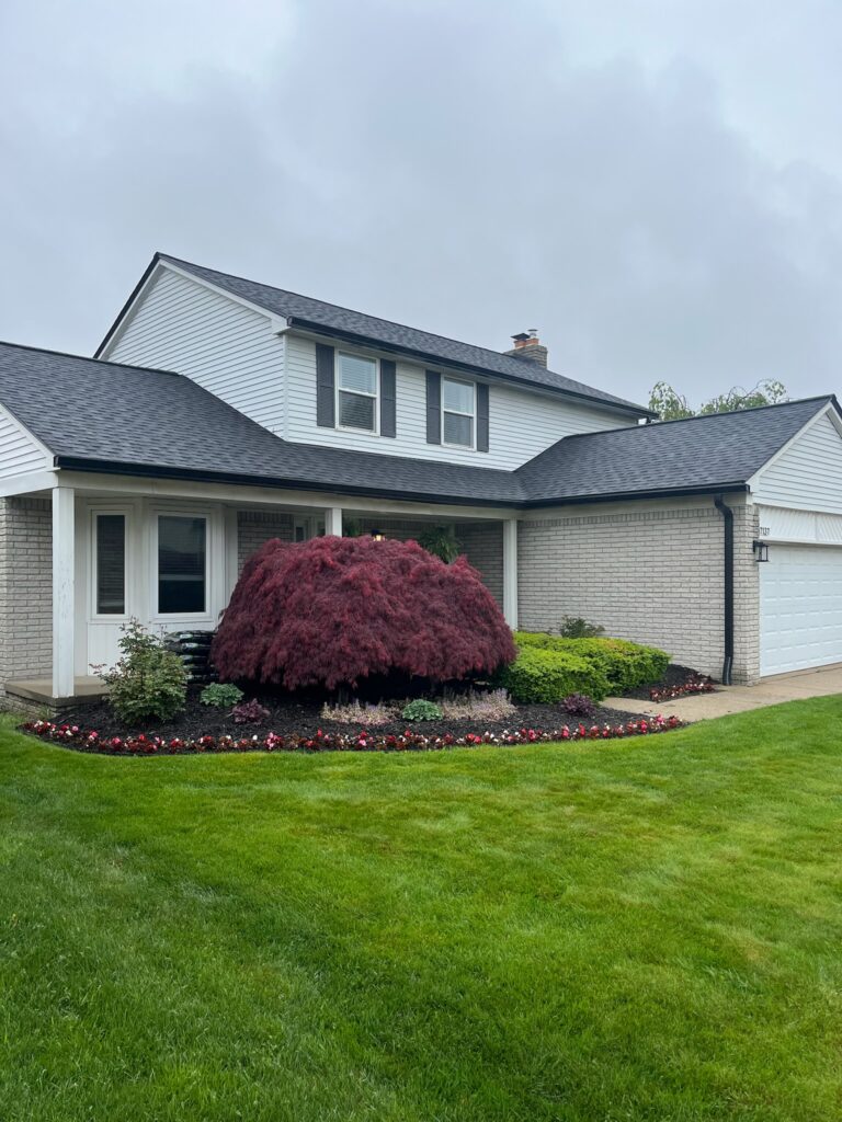 two story white brick home