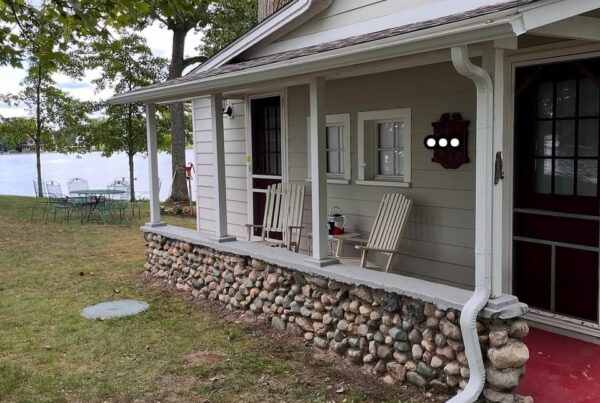 white one story home with white gutters