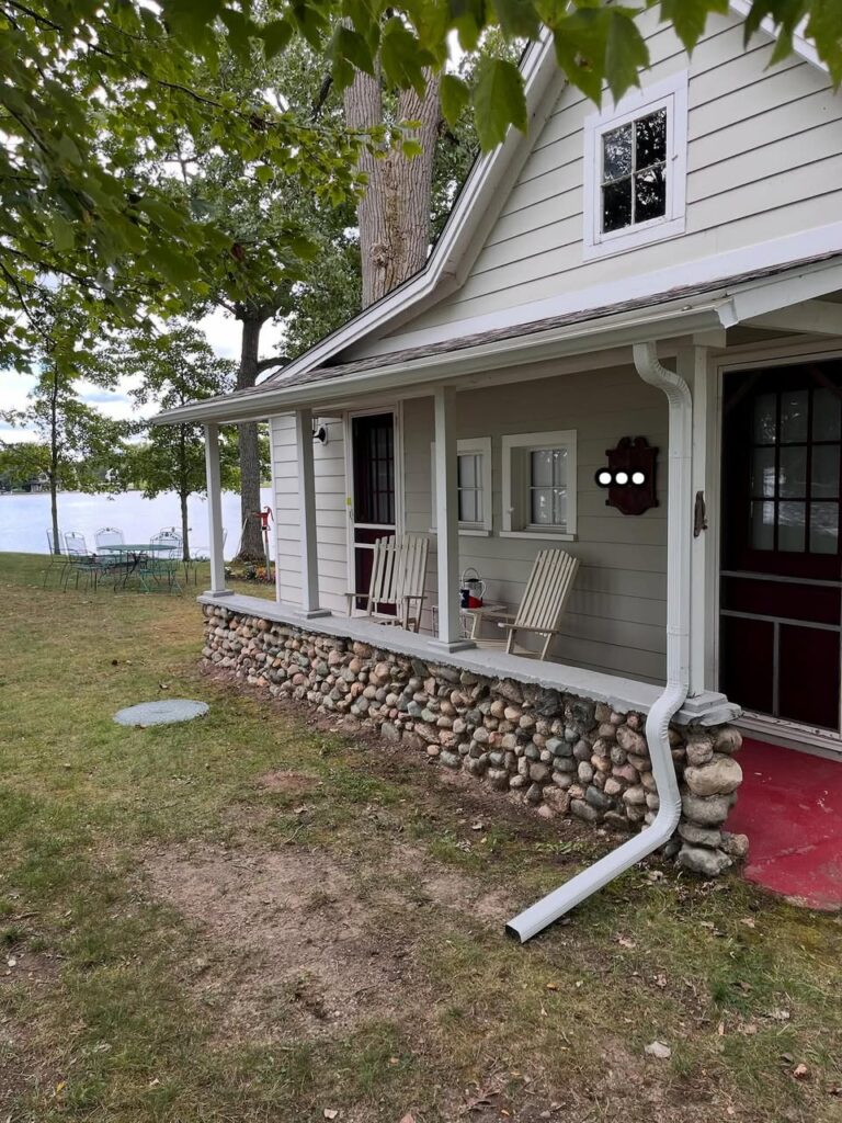 white one story home with white gutters