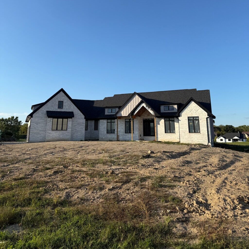 new build, white home with black seamless gutters